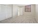 This bedroom has neutral walls, neutral carpet, and a closet at 510 Spring Lakes Blvd, Bradenton, FL 34210