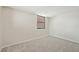 A sunny bedroom with neutral walls, neutral carpet, and large windows at 510 Spring Lakes Blvd, Bradenton, FL 34210