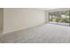 Spacious carpeted living room with sliding doors, perfect for indoor-outdoor living and relaxation at 510 Spring Lakes Blvd, Bradenton, FL 34210