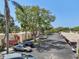 Exterior view of the parking area with a lot of mature tree coverage and assigned parking spots at 510 Spring Lakes Blvd, Bradenton, FL 34210