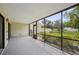 Covered patio space with screens offering relaxing outdoor living with views of the landscaped yard at 510 Spring Lakes Blvd, Bradenton, FL 34210