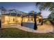Backyard with a pool, gazebo, outdoor kitchen, and screened-in lanai at 5151 Jasmine Way, Palm Harbor, FL 34685