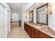 Elegant bathroom with granite countertops and a large soaking tub at 5151 Jasmine Way, Palm Harbor, FL 34685
