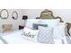 Comfortable bedroom with decorative pillows at 5151 Jasmine Way, Palm Harbor, FL 34685