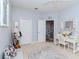 Spacious bedroom with a sitting area and a desk, illuminated by natural light at 5151 Jasmine Way, Palm Harbor, FL 34685