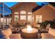 Backyard fire pit with seating offers an inviting outdoor space, with views of the home at 5151 Jasmine Way, Palm Harbor, FL 34685