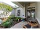 Charming front porch showcasing stone accents and a cozy seating arrangement at 5151 Jasmine Way, Palm Harbor, FL 34685