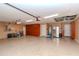 Spacious garage with epoxy floor and ample storage, perfect for organization at 5151 Jasmine Way, Palm Harbor, FL 34685