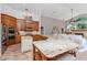 Spacious kitchen boasts granite countertops, stainless steel appliances, and custom wood cabinetry at 5151 Jasmine Way, Palm Harbor, FL 34685