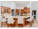 This kitchen features granite countertops, a large center island, and custom wood cabinetry at 5151 Jasmine Way, Palm Harbor, FL 34685