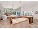 Kitchen with granite countertops, large island, and ample natural light streaming through large windows at 5151 Jasmine Way, Palm Harbor, FL 34685