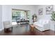 Bright living room with sliding glass doors that seamlessly connect indoor and outdoor spaces at 5151 Jasmine Way, Palm Harbor, FL 34685