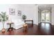 Cozy living room featuring hardwood floors, white sofas, and stylish decor at 5151 Jasmine Way, Palm Harbor, FL 34685