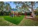Community playground features multiple play structures and open green space at 5151 Jasmine Way, Palm Harbor, FL 34685