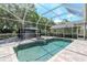 Sparkling pool and patio area with an outdoor kitchen and gazebo at 5151 Jasmine Way, Palm Harbor, FL 34685
