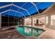 Relax and unwind in this beautiful pool and spa area with views of the home's dining room at 5151 Jasmine Way, Palm Harbor, FL 34685