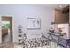 Cozy sitting room with fun furniture, artwork, and decor at 5151 Jasmine Way, Palm Harbor, FL 34685