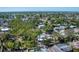 Picturesque aerial view of the neighborhood featuring mature trees and multiple homes at 5404 4Th Avenue Nw Dr, Bradenton, FL 34209