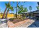 Lush backyard featuring a brick path, garden, mature trees and a screened in pool area at 5404 4Th Avenue Nw Dr, Bradenton, FL 34209