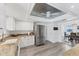 Well-lit kitchen with white cabinets, granite countertops, stainless steel appliances, and wood look floors at 5404 4Th Avenue Nw Dr, Bradenton, FL 34209
