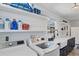 Bright laundry room with new front load washer and dryer, ample counter space, and stylish white cabinets at 5404 4Th Avenue Nw Dr, Bradenton, FL 34209