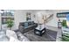 Bright living room with hardwood floors, neutral paint, stylish furniture, and lots of natural light at 5404 4Th Avenue Nw Dr, Bradenton, FL 34209