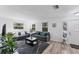 Cozy living area with hardwood floors, white walls, lots of light, and well-coordinated furnishings at 5404 4Th Avenue Nw Dr, Bradenton, FL 34209