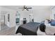 Inviting bedroom with wood-look floors and access to the bathroom and other living spaces at 5404 4Th Avenue Nw Dr, Bradenton, FL 34209