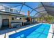 Bright, screened-in pool and hot tub area with ample space for outdoor entertaining at 5404 4Th Avenue Nw Dr, Bradenton, FL 34209