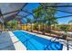 The spacious screened-in pool offers a refreshing escape with ample space for lounging and entertaining at 5404 4Th Avenue Nw Dr, Bradenton, FL 34209