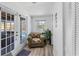 Sunlit sitting area with French doors leading to a pool and outdoor space at 5404 4Th Avenue Nw Dr, Bradenton, FL 34209