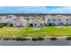Aerial view of backyard and neighborhood with view of the waterfront at 5688 Woodland Sage Dr, Sarasota, FL 34238