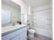 Bathroom featuring a tub, toilet, sink with mirror, and storage cabinet for your household items at 5688 Woodland Sage Dr, Sarasota, FL 34238