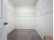 Walk-in closet provides ample storage with wire shelving at 5688 Woodland Sage Dr, Sarasota, FL 34238