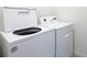 Laundry room showcasing a modern, energy-efficient washer and dryer set at 5688 Woodland Sage Dr, Sarasota, FL 34238