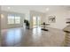 Bright living room with large windows overlooking the water and sliding glass doors to the backyard at 5688 Woodland Sage Dr, Sarasota, FL 34238