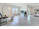 Open living room with a view of the water, access to the backyard, and a comfortable seating area at 5688 Woodland Sage Dr, Sarasota, FL 34238