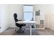 Bright office features carpet floors, bright window, rolling chair and desk at 5688 Woodland Sage Dr, Sarasota, FL 34238