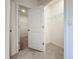 Spacious walk-in closet with tiled floors, wire shelving, and convenient accessibility at 5688 Woodland Sage Dr, Sarasota, FL 34238