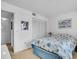 Cozy bedroom with a seashell-patterned comforter and ample closet space at 6501 Stone River Rd # 209, Bradenton, FL 34203