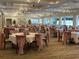 Dining room featuring tables and chairs with cloth draping at 6501 Stone River Rd # 209, Bradenton, FL 34203