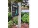 A well-maintained golf course sign shows the details for hole one, a par four, surrounded by beautiful foliage at 6501 Stone River Rd # 209, Bradenton, FL 34203