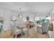 Inviting living room with dining area and access to a private balcony at 6501 Stone River Rd # 209, Bradenton, FL 34203