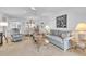 Comfortable living room with ample seating and bright natural light at 6501 Stone River Rd # 209, Bradenton, FL 34203