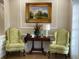 Lobby area features a table, chairs, a lamp, and wall decorations at 6501 Stone River Rd # 209, Bradenton, FL 34203
