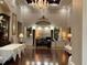 Lobby area features a check-in desk and elegant decor with a chandelier at 6501 Stone River Rd # 209, Bradenton, FL 34203