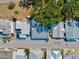 This aerial shot displays the neighborhood's attractive setting, mature trees, and well-maintained streetscape at 7 Braden Castle Dr, Bradenton, FL 34208