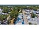 This aerial shot shows the neighborhood's charming homes and lush greenery in a beautiful, sunny setting at 7 Braden Castle Dr, Bradenton, FL 34208