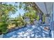 Enjoy outdoor living on the spacious patio under mature trees at 7 Braden Castle Dr, Bradenton, FL 34208