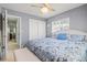 Bright bedroom with a sliding door closet and a view leading to the hallway at 7 Braden Castle Dr, Bradenton, FL 34208